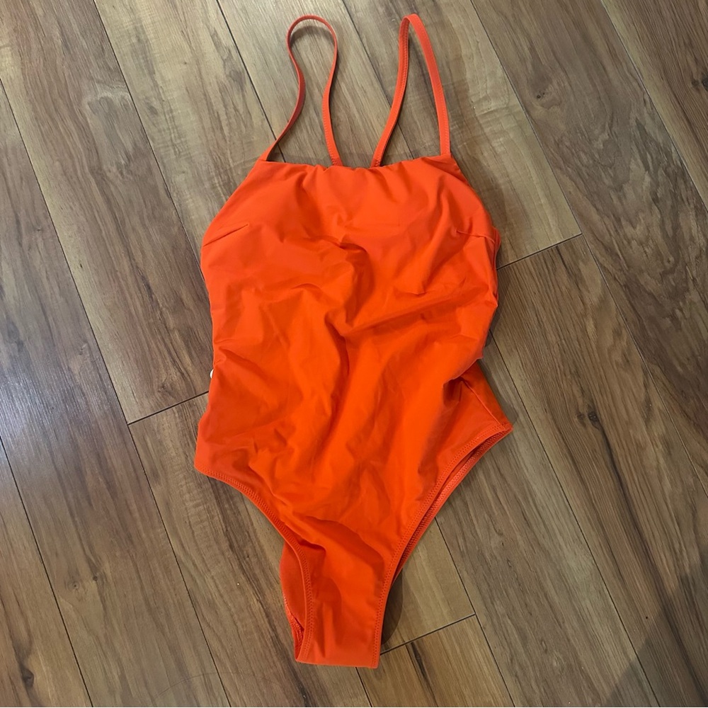 NWT Cheak strapped one piece size small